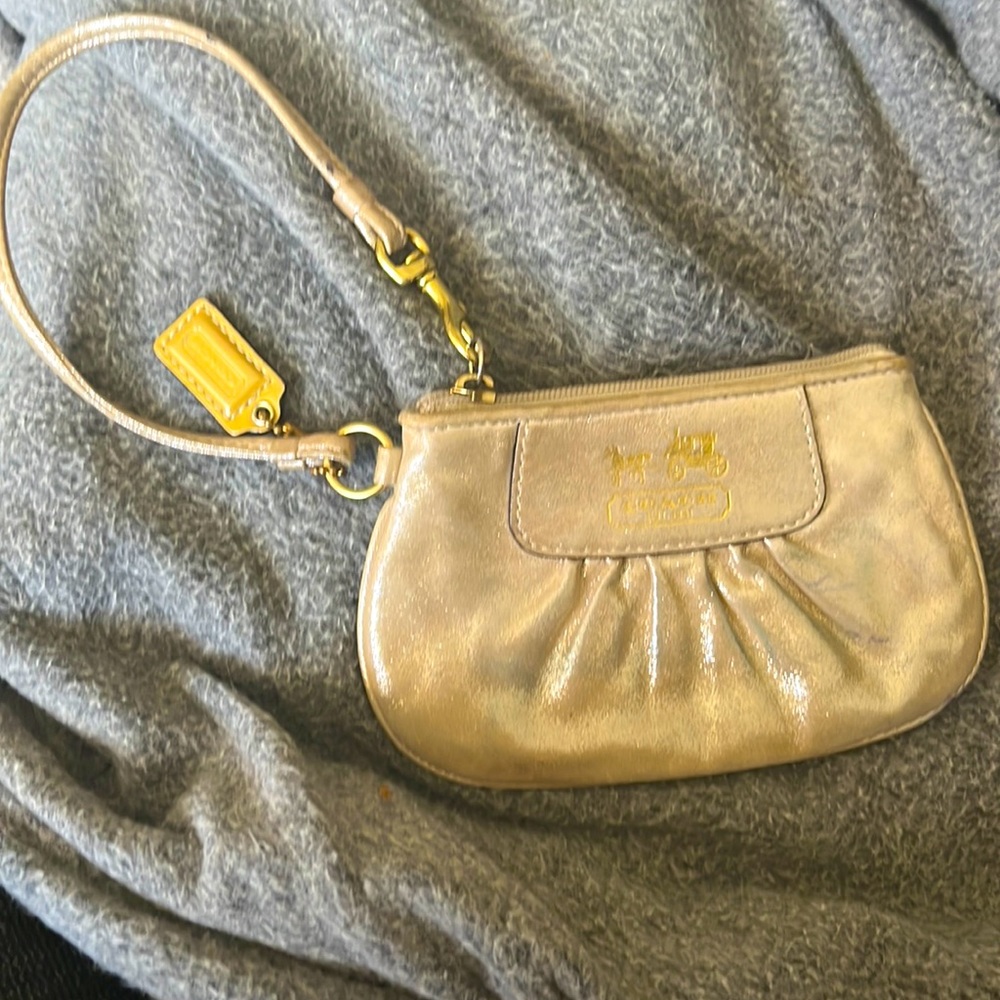 Gold COACH wristlet